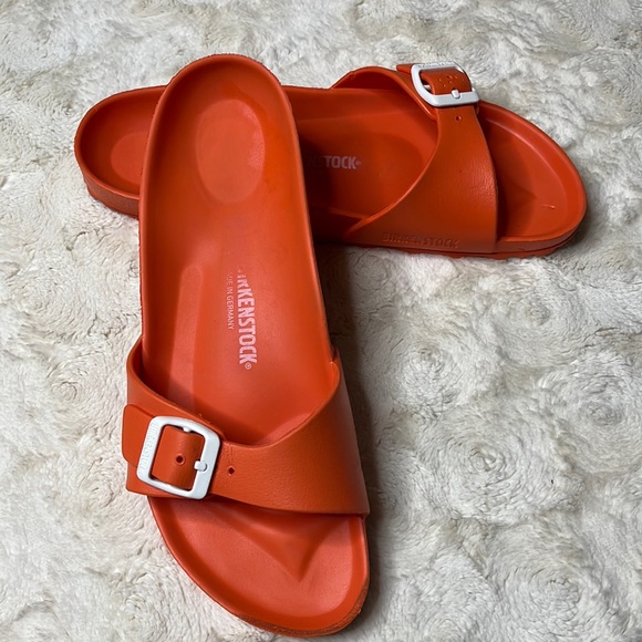 Birkenstock Shoes - Orange Birkenstock slides with white buckle size 41. Very lightweight